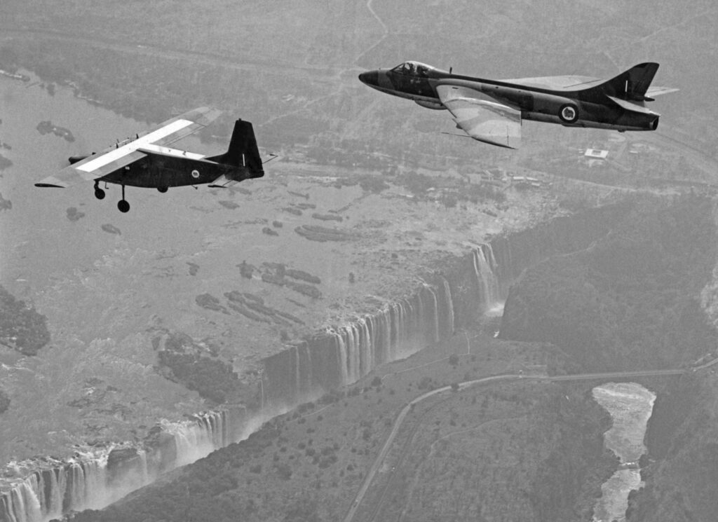 The Hawker Hunter and Rhodesia’s Bush War 3 Hunter FGA9 R1198 with an Aermacchi AL-60 over the Victoria Falls in 1970. The latter type often carried a forward air controller