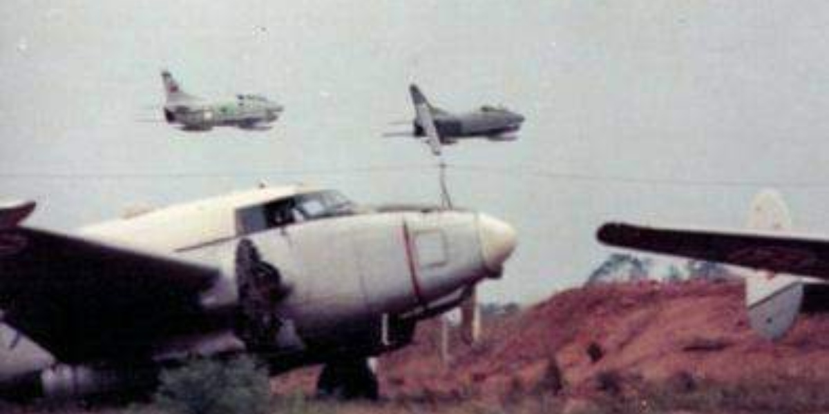 The story of the Fiat G.91R fighter bombers operated by the Portuguese Air Force in Angola 1 two of FAP G.91Rs overflying the ‘famous’ graveyard of the FAP B-26s and PV2 at Luanda International