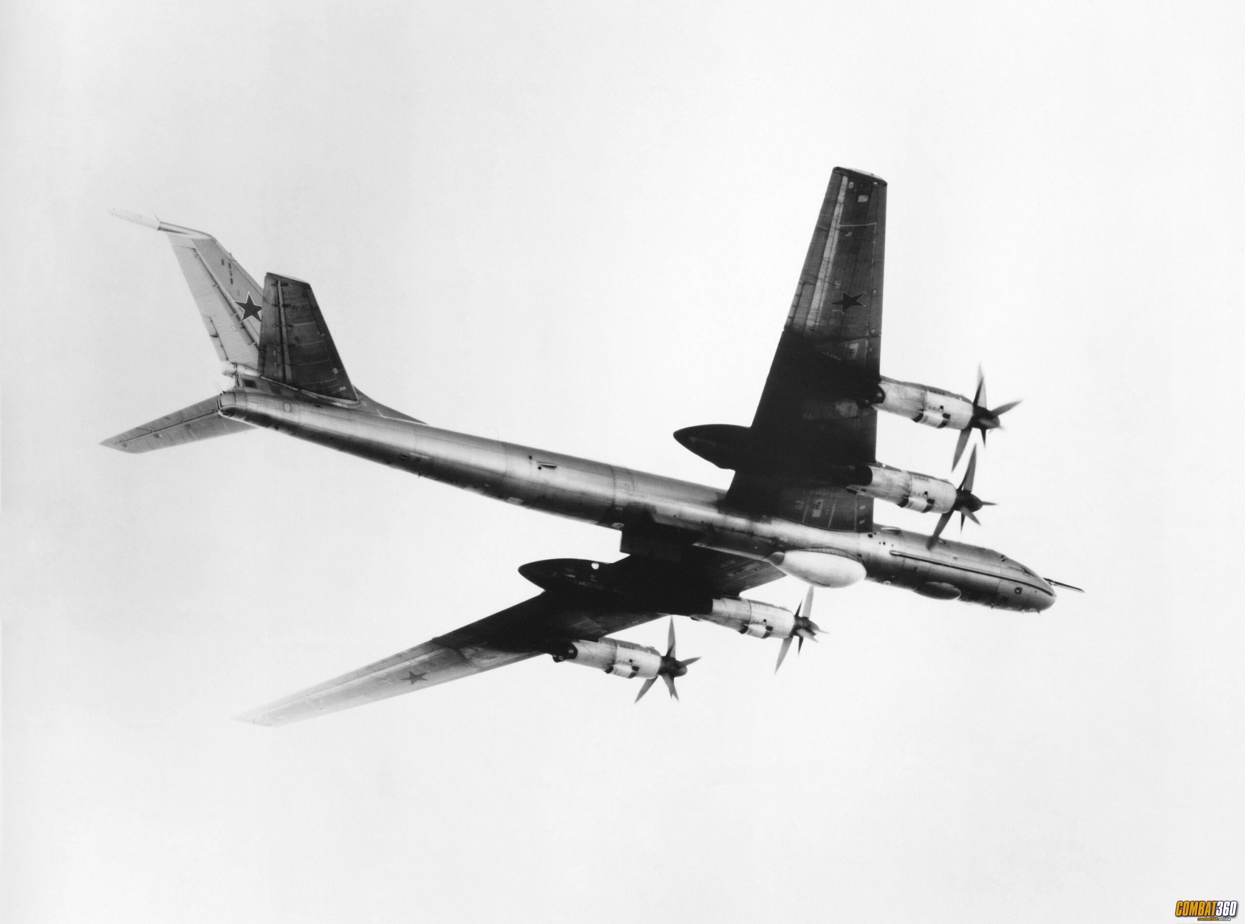 An air-to-air right side view of a Tu-142 Bear F anti-submarine patrol aircraft.