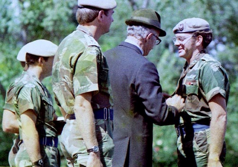 Hon. Dudley Coventry presents Grahame W. with 