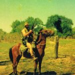 Rhodesian border with Mozambique, 1976. Derek, who at this time was a member of the Greys Scouts, is shown mounted on a pashto Rhodesian horse, which were used to patrol the border region. The Scouts were on the lookout for tracks of the insurgents who would cross into Rhodesia from Mozambique to carry out acts of terrorism.