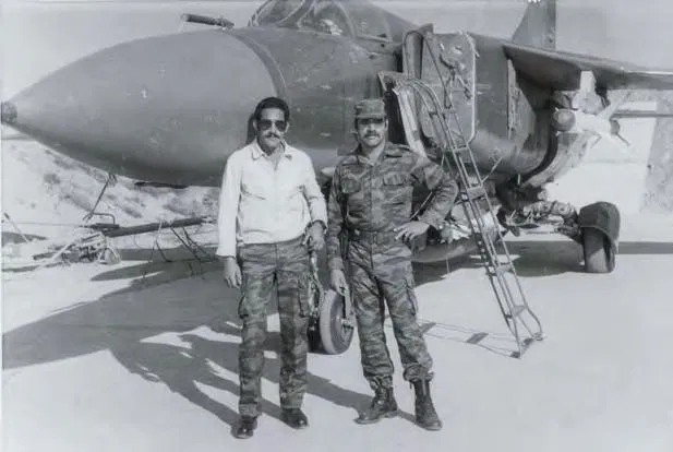 Cuban MiG-23's night attack on SAAF C130B's 4 MiG-23 pilot Lino Vieras (left) and a Cuban intelligence officer next to a MiG-23ML at Huambo in April 1986. An R-24T missile is loaded on the jet’s left shoulder pylon