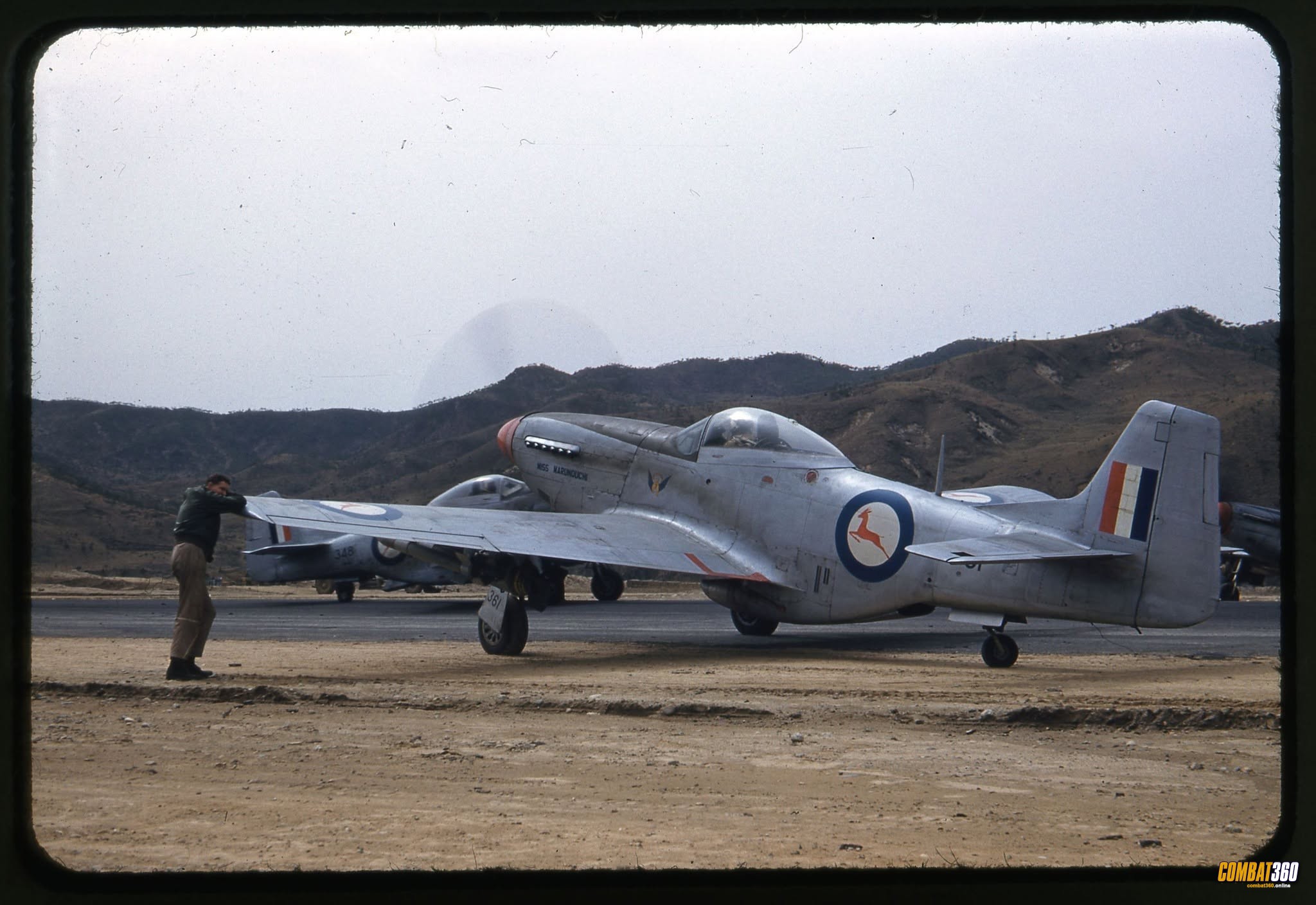 2nd Squadron, South African Air Force, F-51 “Miss Marunouchi” at a base in Korea. National Archives.